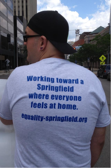 Back of T-Shirt that says "Working toward a Springfield where everyone feels at home equality-springfield.org"